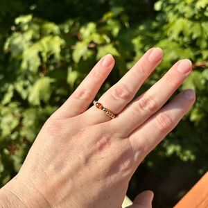 Simple yet beautiful ring golden beads on a rubber band Halloween colors detail